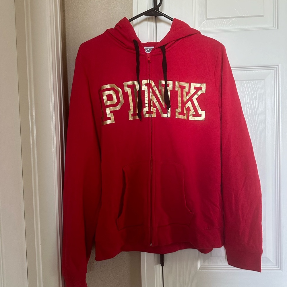 Pink Victoria’s Secret Women zip up hoodie.